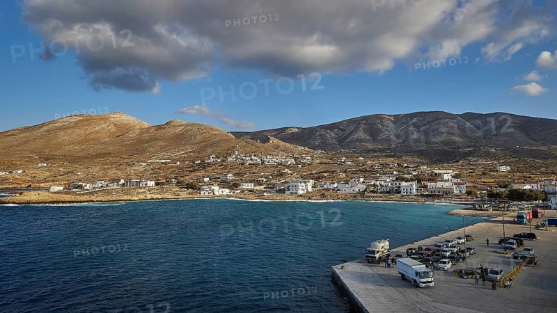 Coastal village with buildings and a harbour in the foreground, surrounded by mountains, Kassos Island, neighbouring island Karpathos, Dodecanese, Greek Islands, Greece, Europe