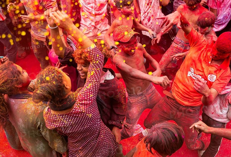 Revellers smear with Gulal or coloured powder and dance to play Holi, the Hindu spring festival of colours, on March 14, 2025 in Guwahati, India, Asia