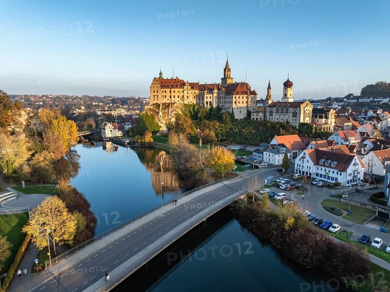 Aerial view of the town of Sigmaringen with the Hohenzollern Castle, a sight and tourist attraction above the old town and the Danube with autumnal vegetation, Danube valley, district of Sigmaringen, Baden-Württemberg, Germany, Europe
