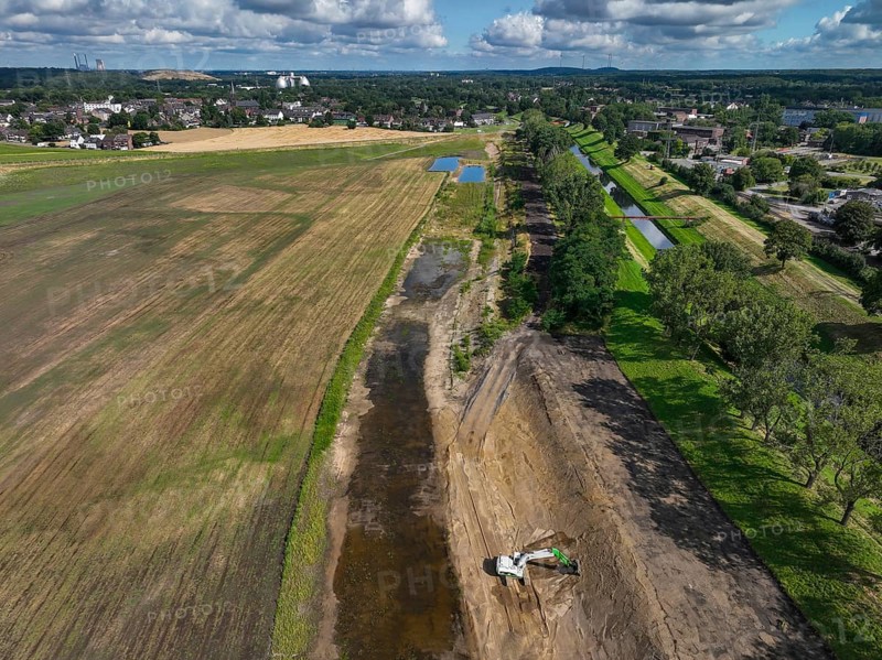 Oberhausen, North Rhine-Westphalia, Germany, renaturalisation of the Emscher in the Holtener Bruch. A new floodplain landscape for flood protection and biodiversity is being created here. The Emscher, which is currently straightened, is being given curves again and can meander through its new floodplain. The ecological reorganisation of the Emscher system consists of the construction of a central wastewater treatment system in the Ruhr area, the construction of sewers and the renaturation of the Emscher and its tributaries. Following the construction of a parallel sewer, the Emscher has been completely free of sewage since January 2022. The river was previously an open, above-ground combined sewer with rainwater and wastewater, Europe