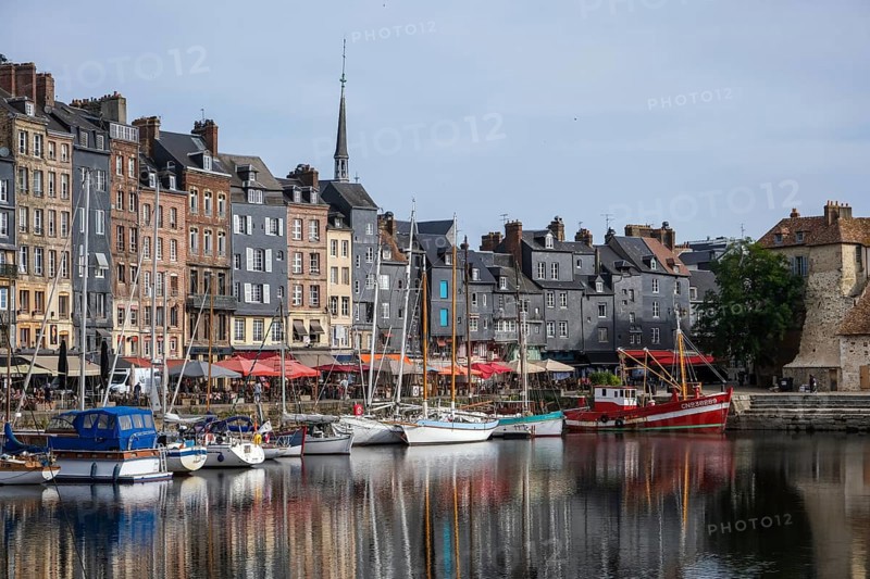 Honfleur, Normandy, France - Boats on the Quai Sainte-Catherine in the old harbour, Vieux Bassin, in the picturesque harbour town of Honfleur at the mouth of the Seine