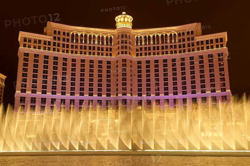 Illuminated Bellagio Hotel with water fountains in front of it at night, Las Vegas, Nevada, USA, North America