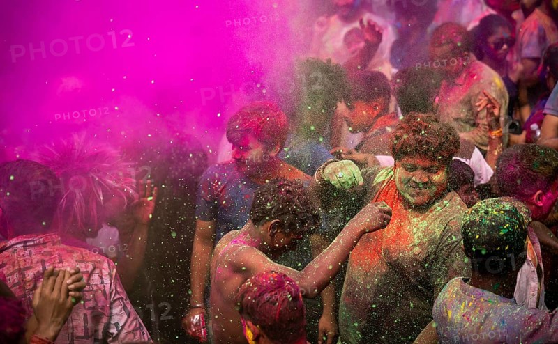 Revellers smear with Gulal or coloured powder and dance to play Holi, the Hindu spring festival of colours, on March 14, 2025 in Guwahati, India, Asia