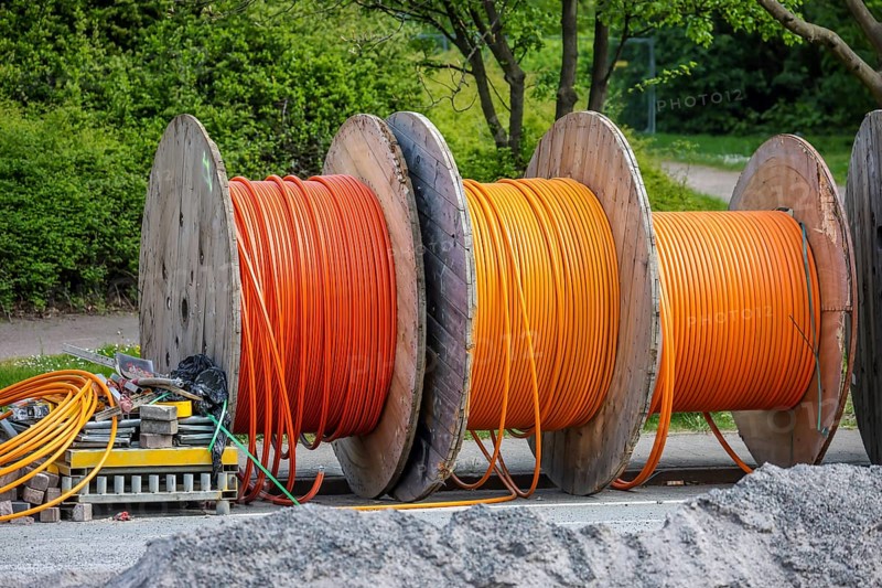 Duisburg, North Rhine-Westphalia, Germany, Internet broadband expansion, construction site for laying fibre optic cable, cable drum with fibre optic cable, new construction of fibre optic routes, fast Internet, DSL cable connection for households, Europe