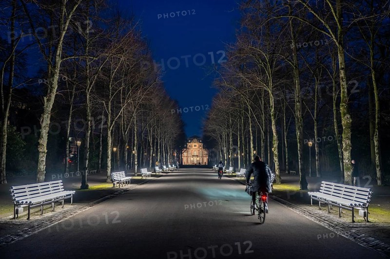 The light benches by artist Stefan Sous in the Hofgarten, entitled UV-A UV-B, 14 completely refurbished exhibits from the 2002 light-grey art exhibition, which now stand and light up as a permanent work of art on Jägerhofallee, LED technology, in the background Jägerhof Palace, home of the Goethe Museum, Düsseldorf, North Rhine-Westphalia, Germany, Europe