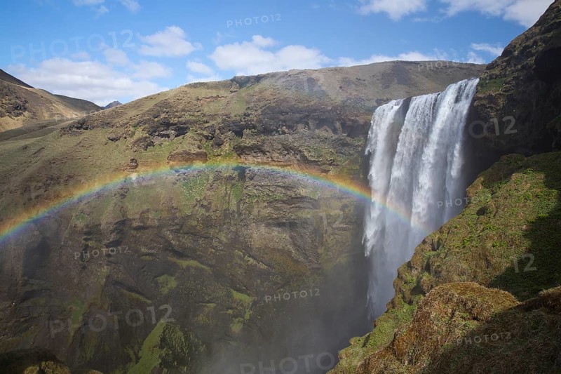 Skógafoss is a waterfall situated on the Skógá River in the south of Iceland. Height 60 m, width 25 m. Rainbow over the waterfall