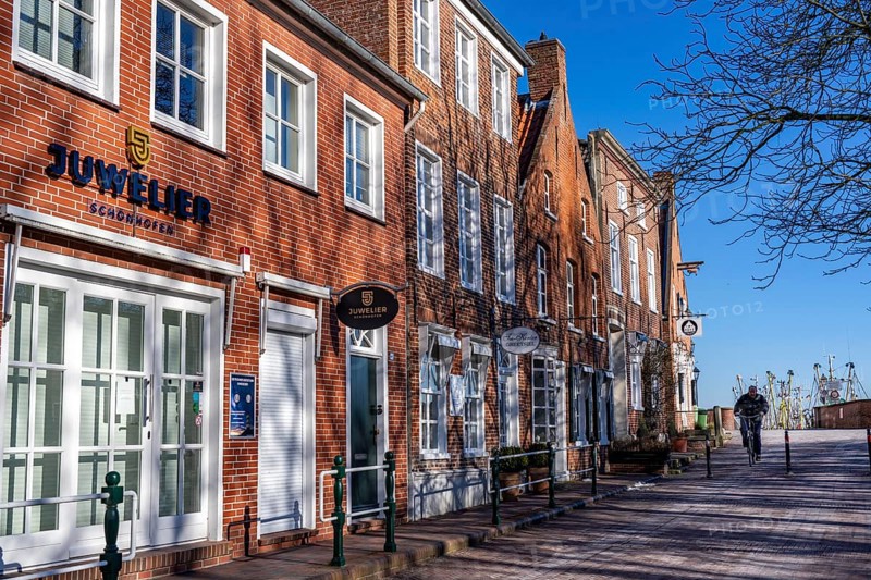 The fishing village of Greetsiel, municipality of Krummhörn, historic houses at the fishing harbour, in winter, Lower Saxony, Germany, Europe