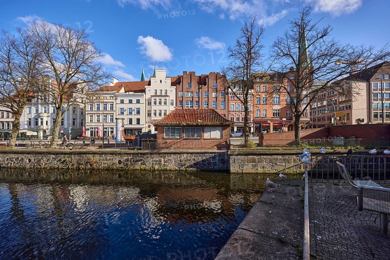 River Trave, historic houses, blue sky with fair weather clouds, quay wall, railing, street An der Untertrave, Hanseatic city of Lübeck, independent city, Schleswig-Holstein, Germany, Europe