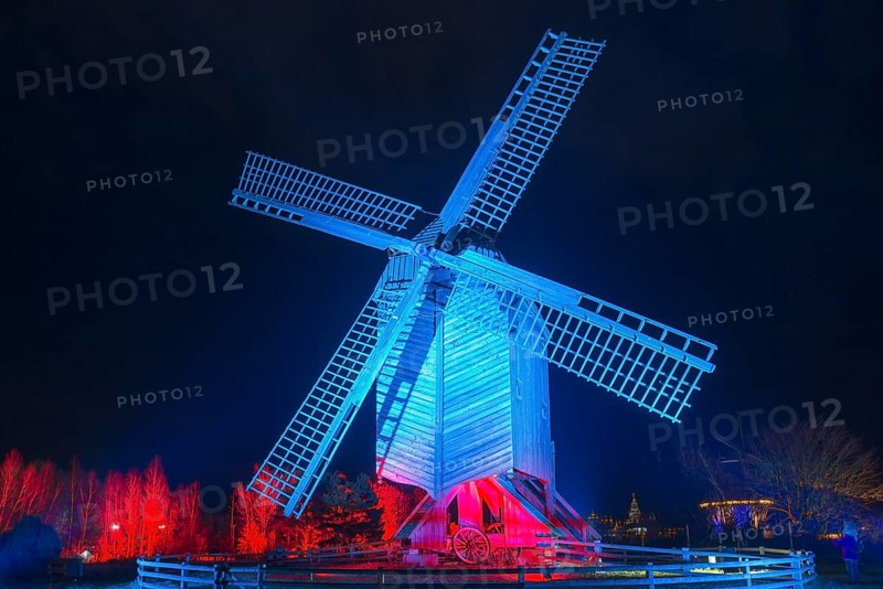 Illuminated windmill with red and blue effects at night, world of lights, illumination, mill museum, Gifhorn, Lower Saxony, Germany, Europe