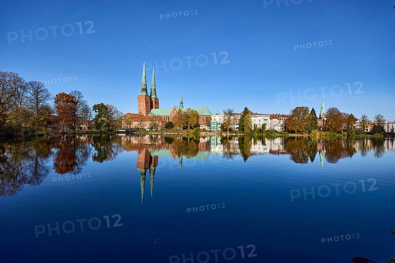 Long shot of the mill pond, trees, Lübeck Cathedral, general buildings, symmetrical reflections on the water surface, Hanseatic City of Lübeck, independent city, Schleswig-Holstein, Germany, Europe