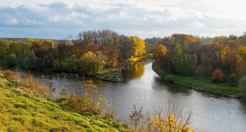 River, surrounded by autumnal trees and meadow landscape under a cloudy sky, confluence of the Elbe and Vltava rivers, Melnik, Melnick, Elbe River, Central Bohemia, Czech Republic, Europe