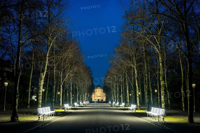 The light benches by artist Stefan Sous in the Hofgarten, entitled UV-A UV-B, 14 completely refurbished exhibits from the 2002 light-grey art exhibition, which now stand and light up as a permanent work of art on Jägerhofallee, LED technology, in the background Jägerhof Palace, home of the Goethe Museum, Düsseldorf, North Rhine-Westphalia, Germany, Europe