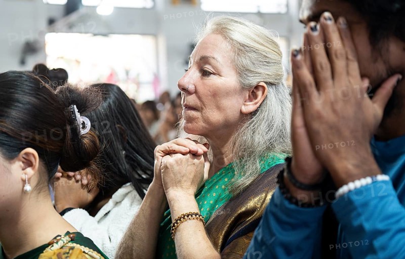 Devotees pray in church during a Christmas day sermon on December 25, 2024 in Guwahati, India. Christmas is a festive holiday celebrated on December 25th, marking the birth of Jesus Christ in Christian tradition.