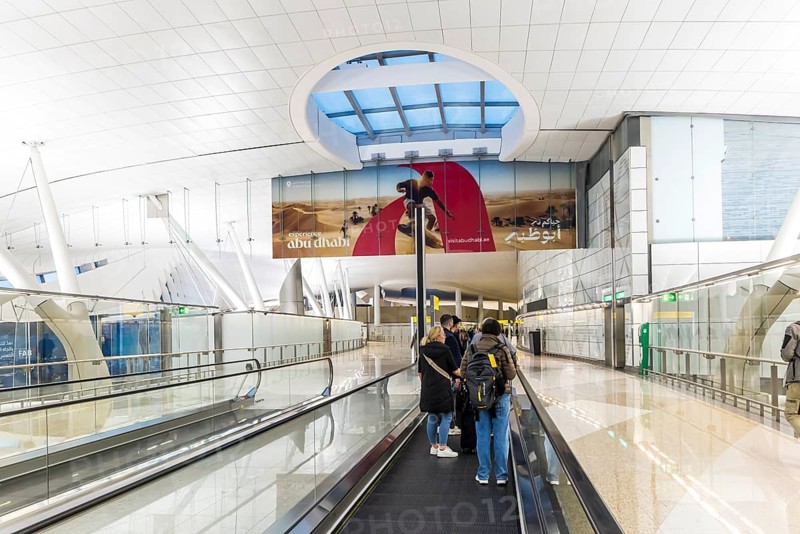 Abu Dhabi Airport, Zayed International Airport with passengers. The new Terminal A has a capacity of 45 million passengers per year. Modern architecture. Abu Dhabi, United Arab Emirates, UAE, Asia