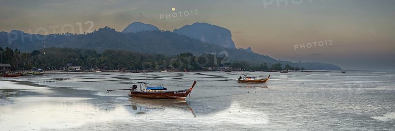 Before sunrise, longtail boats lie at low tide in the harbour at Sivalai Beach, Koh Mook Island, Satun Province, Southern Thailand, Thailand, Asia