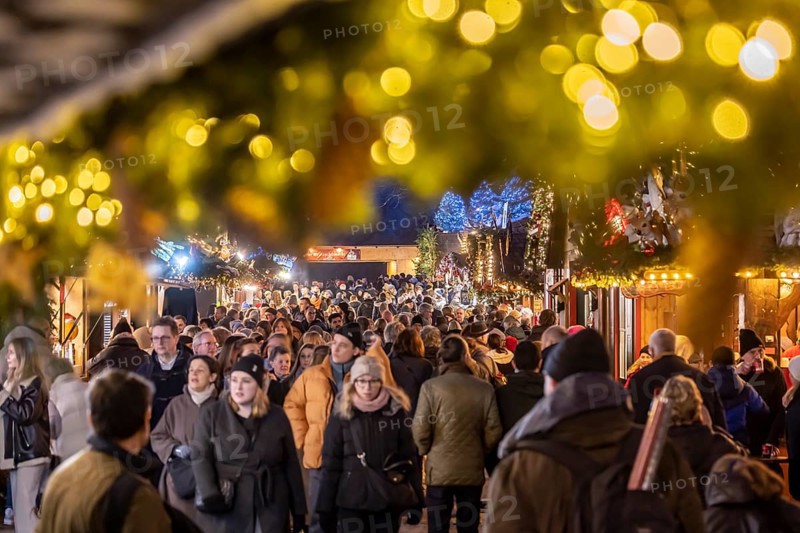 Stuttgart Christmas market at the blue hour. The traditional event attracts more than three and a half million people to the city centre during the Christmas season. Crowds of people on Schillerplatz in Stuttgart, Baden-Württemberg, Germany, Europe