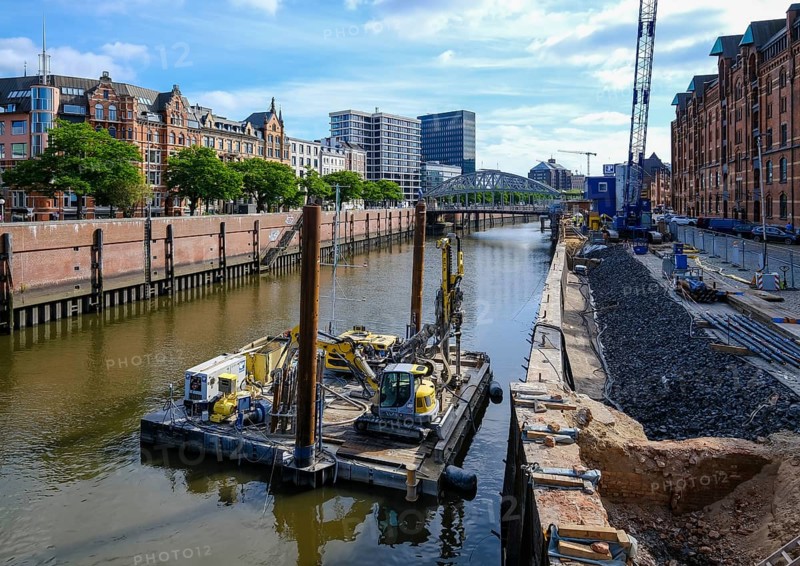 Hamburg, Germany - Speicherstadt, construction work in the canal, renovation of the water channel, here the quay wall