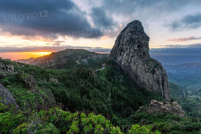 View of the Roque de Agando rock tower, one of La Gomera's landmarks, from the Mirador Roque de Agando. Sunrise, good weather. Monumento Natural de Los Roques, La Gomera, Canary Islands, Spain, Europe