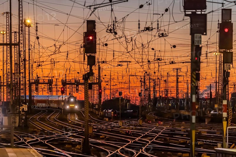 Track apron with trains, rails, points, pylons and signalling systems. Infrastructure at the main station. Sunset. Frankfurt am Main, Hesse, Germany, Europe