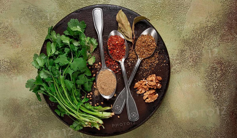 Georgian spices in spoons, on ketsi, top view, no people