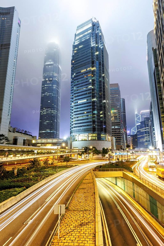 Hong Kong at night traffic with streets and skyscrapers in Hong Kong, China, Asia