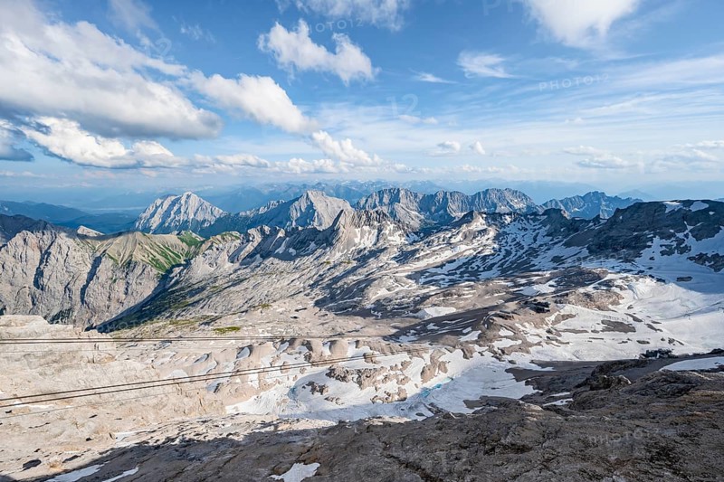 Zugspitzplatt with snow remains, mountain panorama from the summit of the Zugspitze, Wetterstein range, Bavaria, Germany, Europe