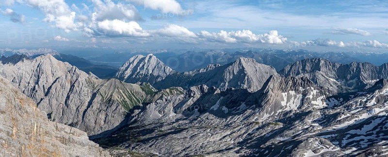 View of the Zugspitzplatt and mountain peaks of the Mieminger Kette with Hohe Munde and Hochwand, view from the summit of the Zugspitze, Wetterstein range, Bavaria, Germany, Europe