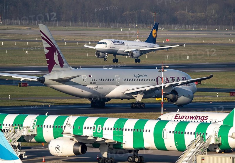 Düsseldorf Airport, Qatar Airways Boeing 787 Dreamliner, Eurowings aircraft on the apron, taxiway, Lufthansa Airbus on landing, North Rhine-Westphalia, Germany, Europe