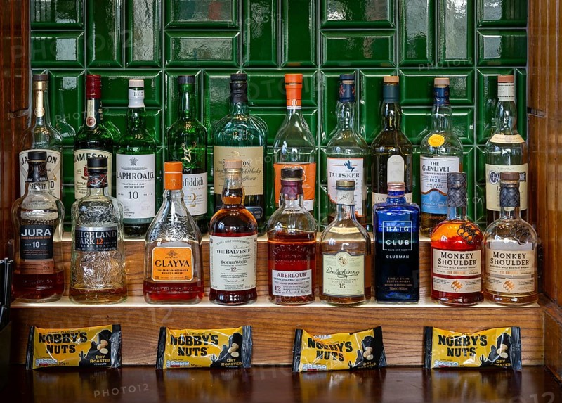 Bottles of different whisky brands, Crown Hotel pub in city centre of Liverpool, England, UK