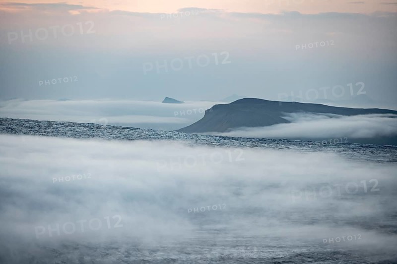 Fog over the glacier ice of Myrdalsjökull glacier, at sunset, Pakgil, Iceland, Europe