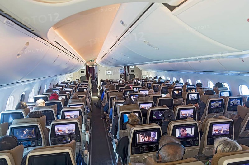 Etihad airline aircraft, interior, rows of seats with passengers. Boeing 787 aircraft on a flight to Munich. Abu Dhabi, United Arab Emirates, UAE, Asia