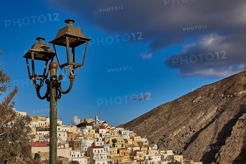Old village in the mountains under a blue sky with streetlights in the foreground, Colourful mountain village, Morning light, Olymbos, Karpathos, Dodecanese, Greek Islands, Greece, Europe