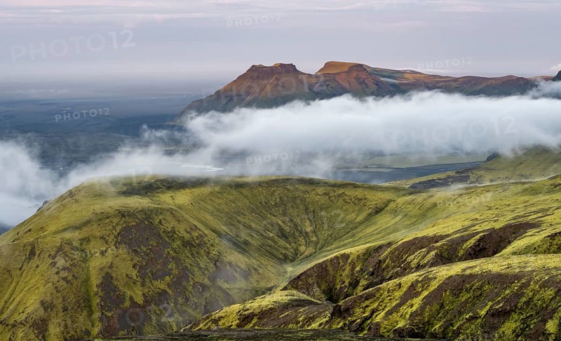 Fog between mountains, moss-covered volcanic mountain landscape, at sunset, Pakgil, Iceland, Europe