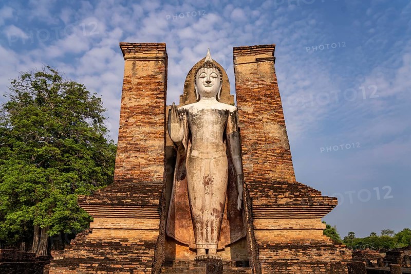 Giant standing Buddha in the Wat Mahathat temple in the UNESCO World Heritage Sukhothai Historical Park, Thailand, Asia