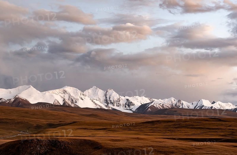 Glaciated and snow-capped mountains, dramatic landscape, high plateau, autumnal mountain landscape with yellow grass, Tian Shan, Sky Mountains, Sary Jaz Valley, Kyrgyzstan, Asia
