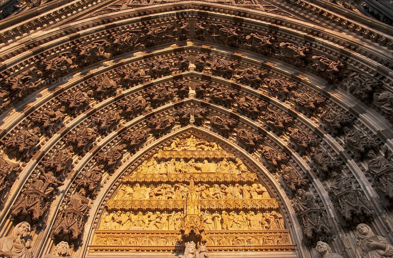 Main portal of the west façade of Cologne Cathedral with statue of the Virgin Mary, baby Jesus and the story of salvation in front of the Redemption, Cologne, North Rhine-Westphalia, Germany, Europe
