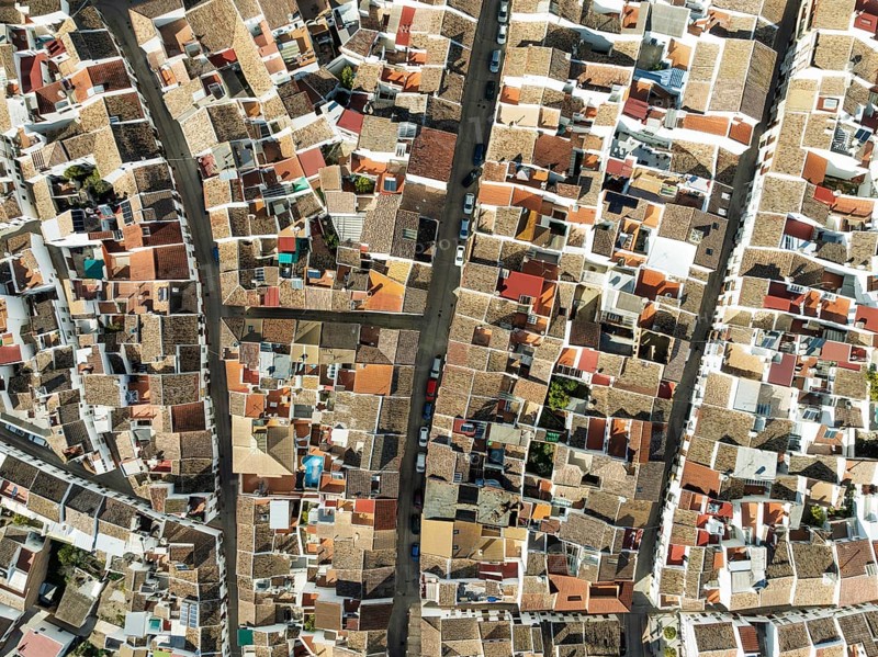 Streets and rooftops in the White Town of Olvera. Aerial view. Drone shot. Cádiz province, Andalusia, Spain, Europe