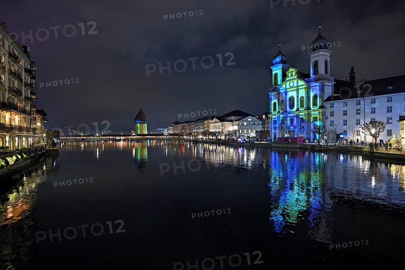 Water tower and Jesuit church on the right with light installation, on the Reuss at dusk, Old Town, Lilu, Light Festival 2025, Lucerne, Canton of Lucerne, Switzerland, Europe
