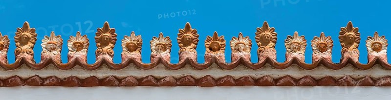 Close-up of a decorative roof ornament with ornate patterns under a blue sky, Poros, Poros Island, Saronic Islands, Peloponnese, Greece, Europe