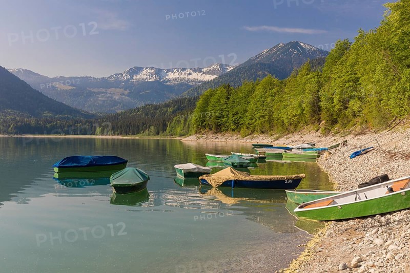 Boats at the beach. Early morning at the Sylvenstein reservoir, Reservoir in the Isarwinkel, municipality of Lenggries, built between 1954 and 1959 for flood protection in the Isar valley