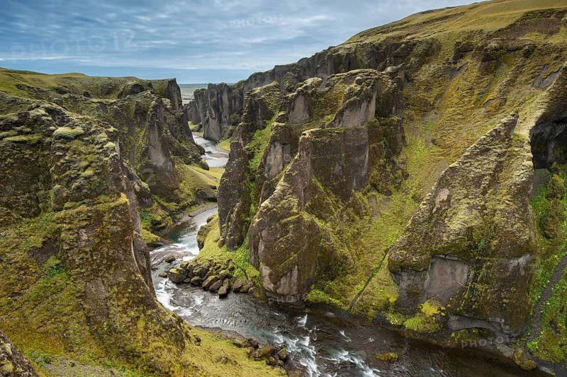 The river Fjaðrá flows through the gorge Fjaðrárgljúfur, Fjadrargljufur near Kirkjubæjarklaustur in summer, Iceland, Europe