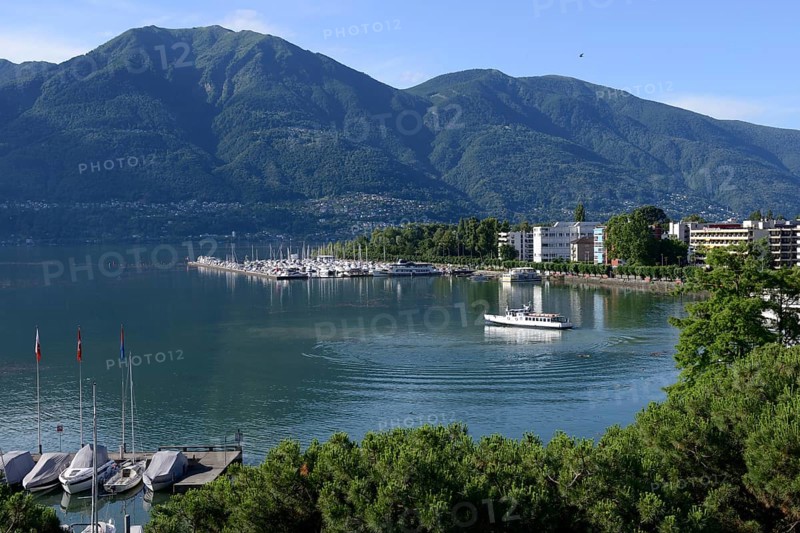 View of Lake Maggiore with marina and town, Locarno, Canton Ticino, Switzerland, Europe
