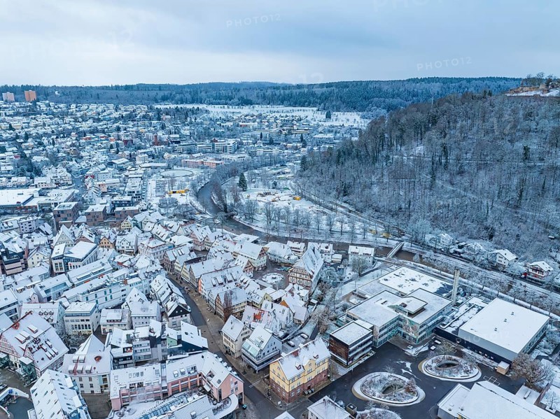Winter city view with river, viaduct and snow-covered hills, Nagold, Black Forest, Germany, Europe
