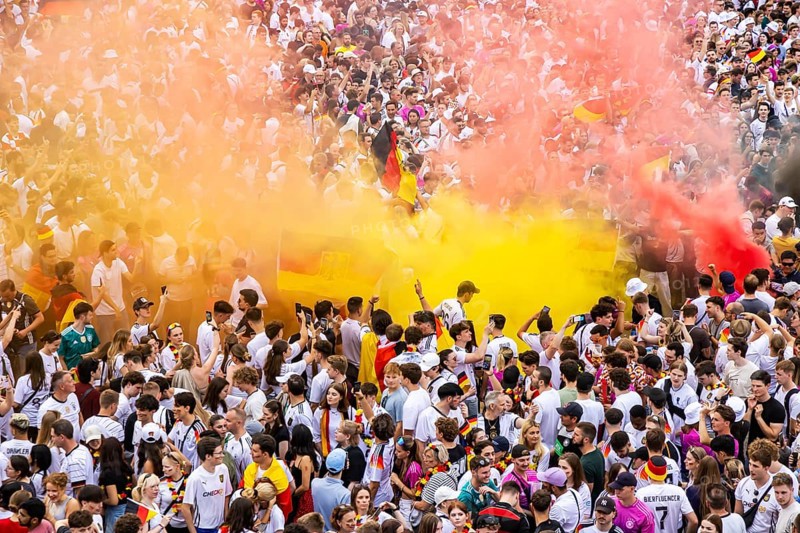 UEFA European Football Championship. Enthusiastic fans at the public viewing in the host city of Stuttgart under the motto: the whole city a stadium. Pyrotechnics. 30, 000 football fans with German flags on the Schlossplatz in Stuttgart, Baden-Württemberg, Germany, Europe