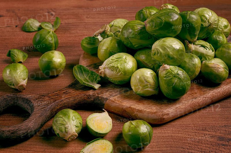 Fresh Brussels sprouts, raw, top view, on a wooden table, no people