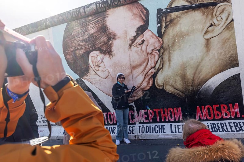 East Side Gallery. Remnant of the Berlin Wall, designed by artists. Landmark and city view Berlin, Germany, Europe