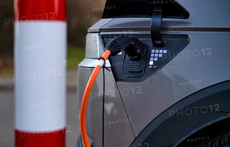 E-vehicle Hyundai IONIQ 5 at charging station for electric cars, charging station, e-mobility, charging cable leads into e-car, charge level indicator, Stuttgart, Baden-Württemberg, Germany, Europe