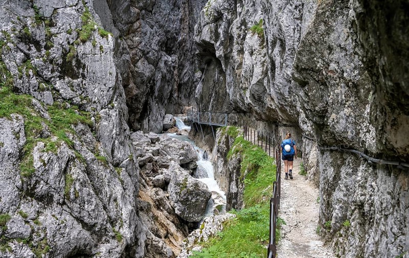 Hiker in a gorge, Hammersbach flows through Höllentalklamm, near Garmisch-Partenkirchen, Werdenfelser Land, Upper Bavaria, Bavaria, Germany, Europe