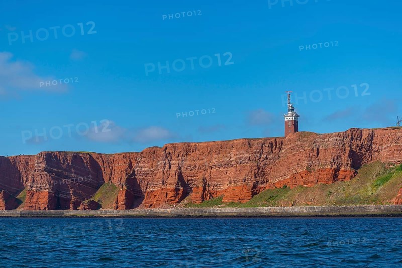 Red mottled sandstone cliff edge, Heligoland high sea island, lighthouse, geology, scree, blue sky, North Sea, Pinneberg district, Schleswig-Holstein, Heligoland, Schleswig-Holstein, Germany, Europe