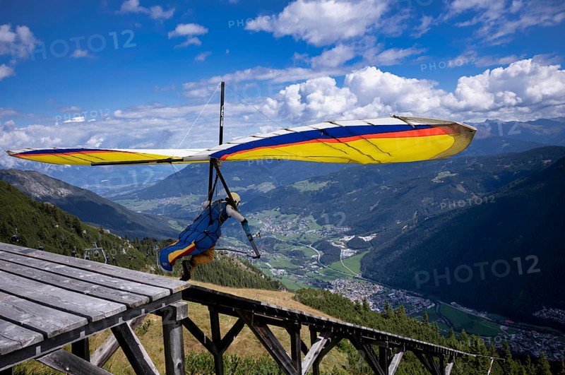 Hang glider takes off from ramp, Panorama Restaurant Kreuzjoch, Schlick 2000, Fulpmes, Stubai Valley, Tyrol, Austria, Europe